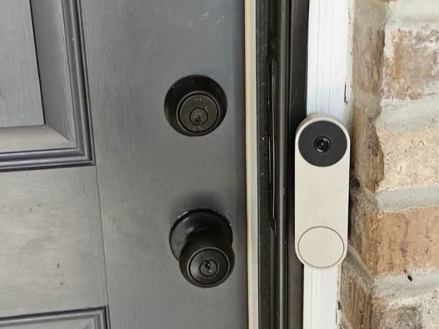Before the lock installation: the same front door with a plain deadbolt and entry knob.